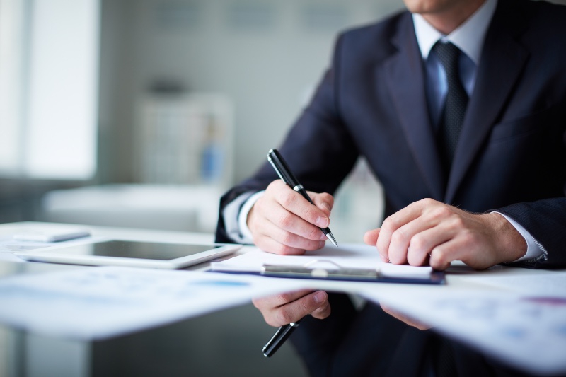 a solicitor signing a document