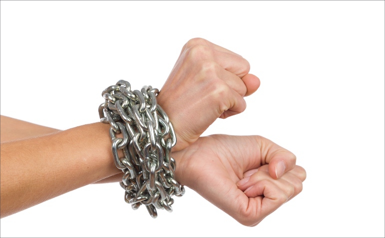 hands tied with a metal chain