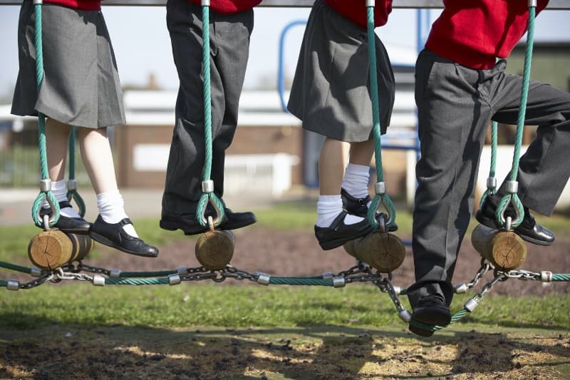 children playing on log swing