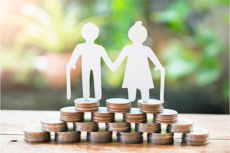 man and woman standing on coins