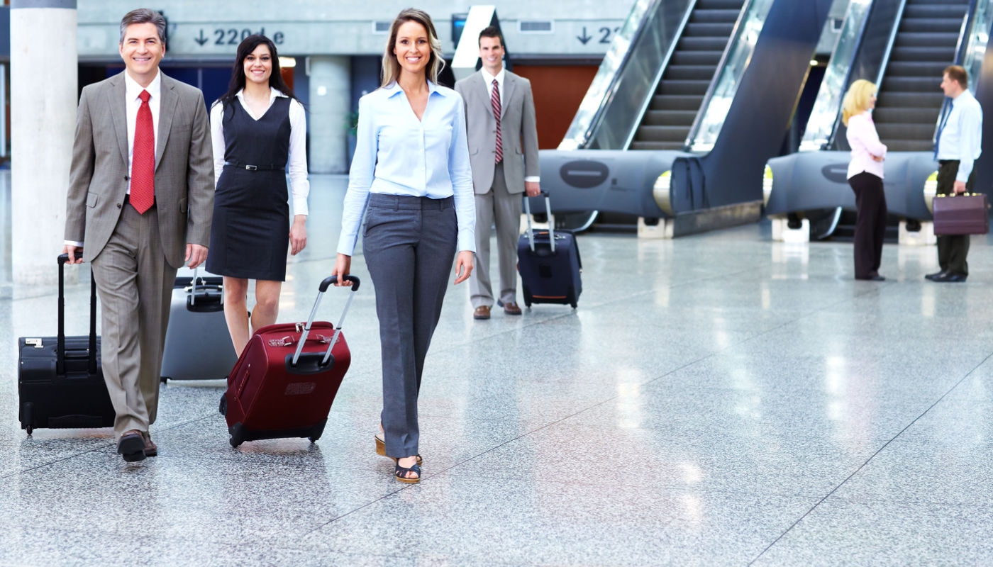 Business people at an airport with luggage