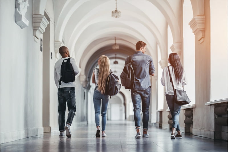 university students walking along