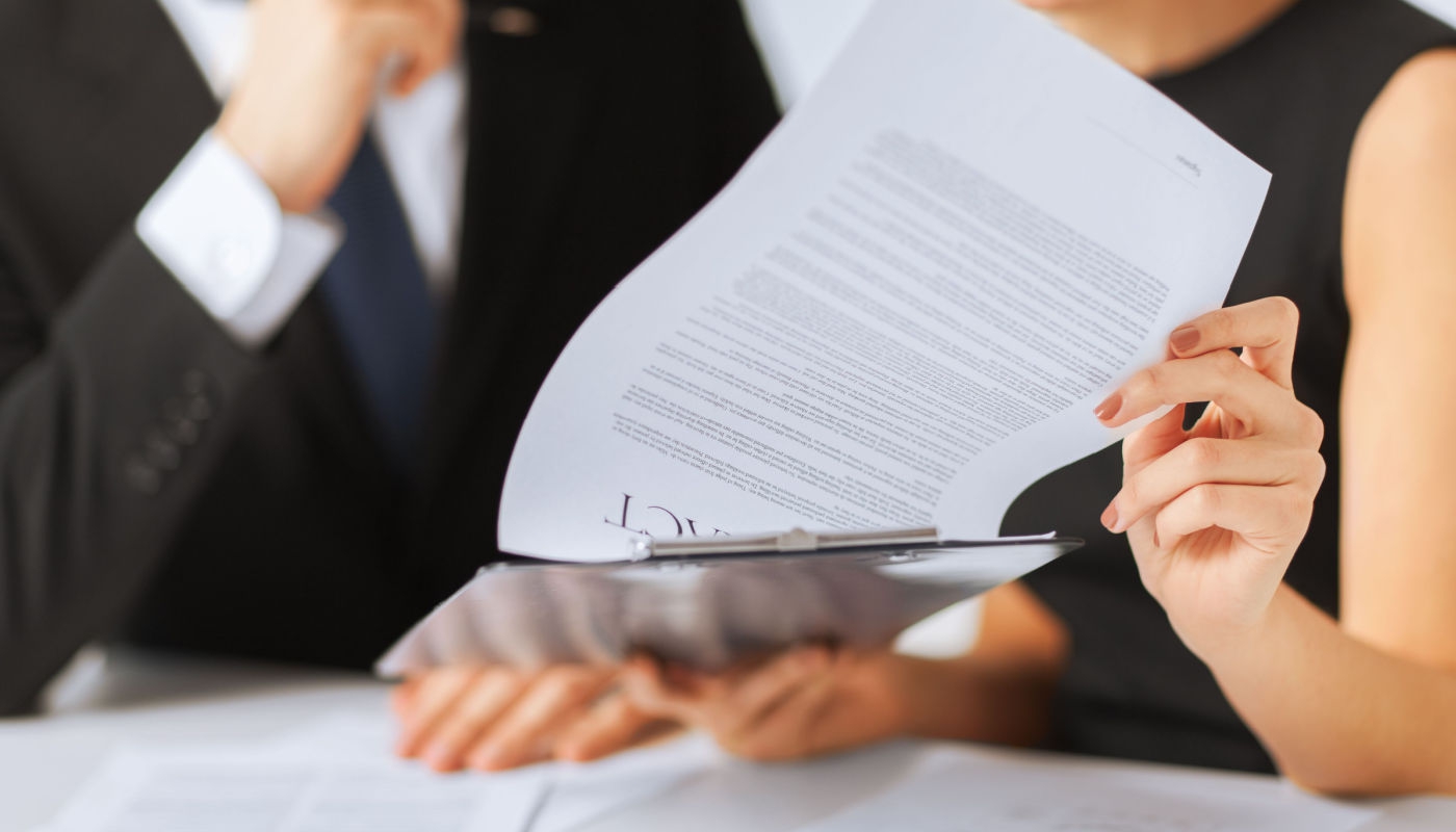 someone looking at a work contract