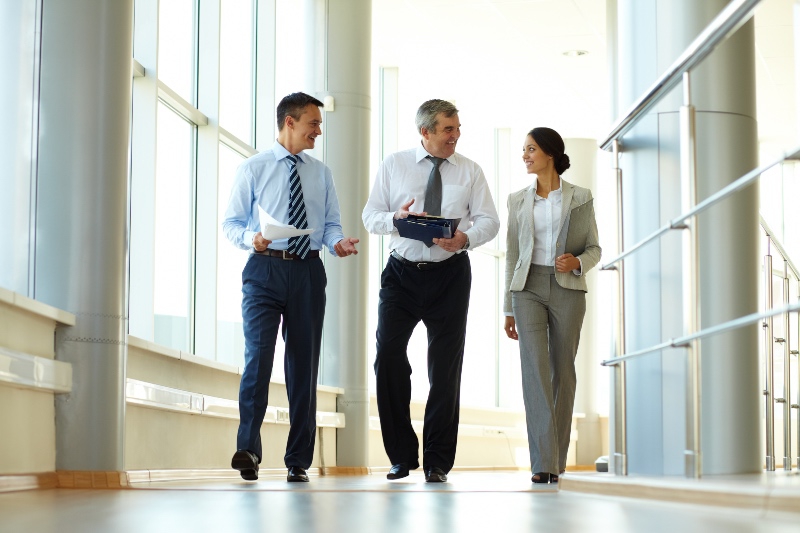 three solicitors walking and chatting