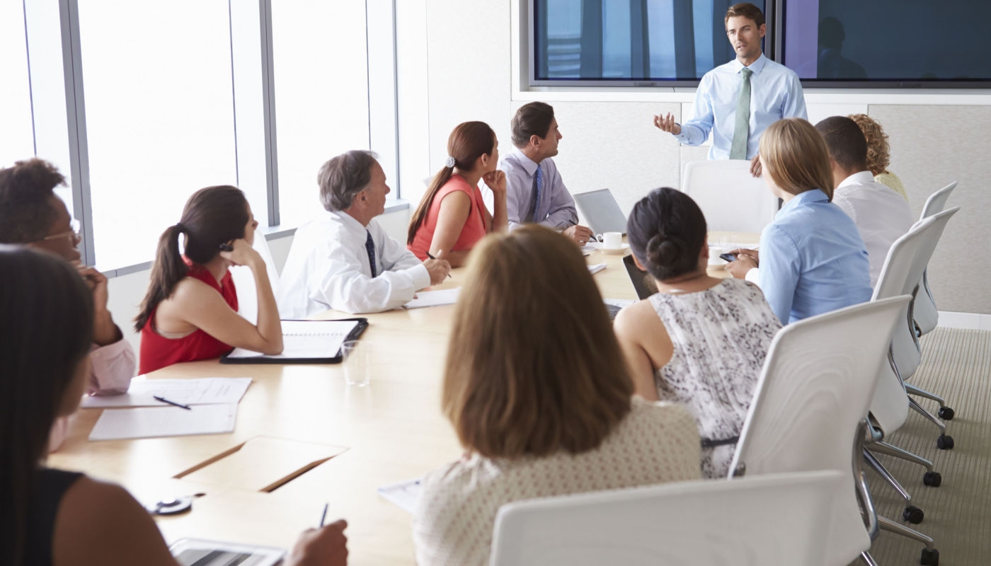 people having a meeting around a table
