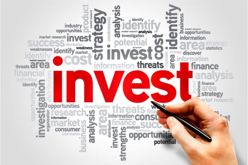 card with invest on it in red