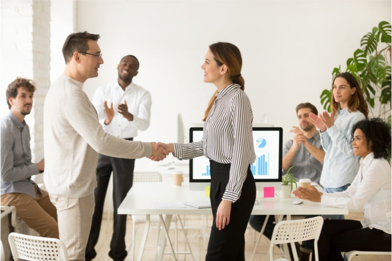 shaking hands with an employee