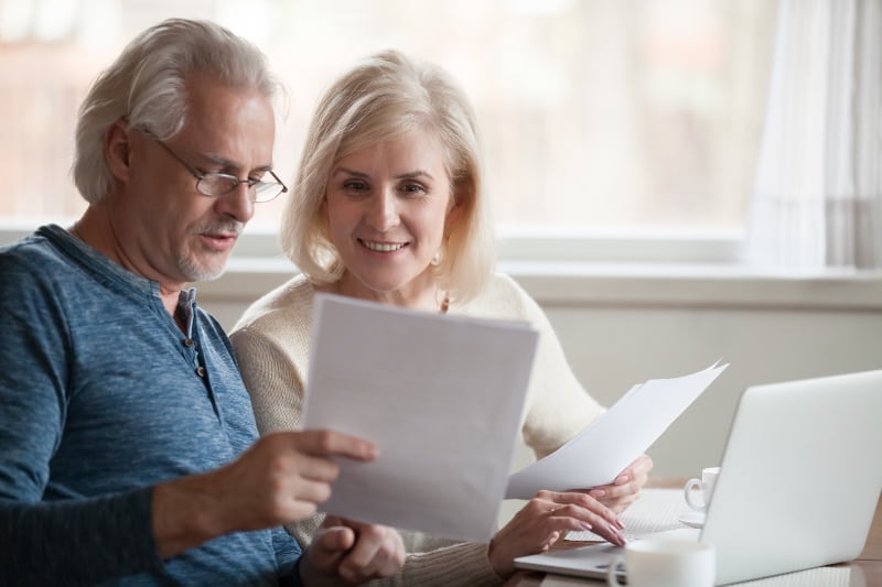 people looking at a pensions document